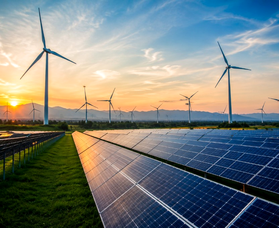 Solar farm and wind turbines at sunset